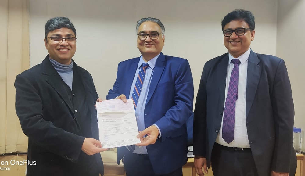 Image for New Delhi Branch paid Policy claim of Rs.24.82 lacs to M/s Godfrey Phillips India Ltd by GM Shri P L Thakur.