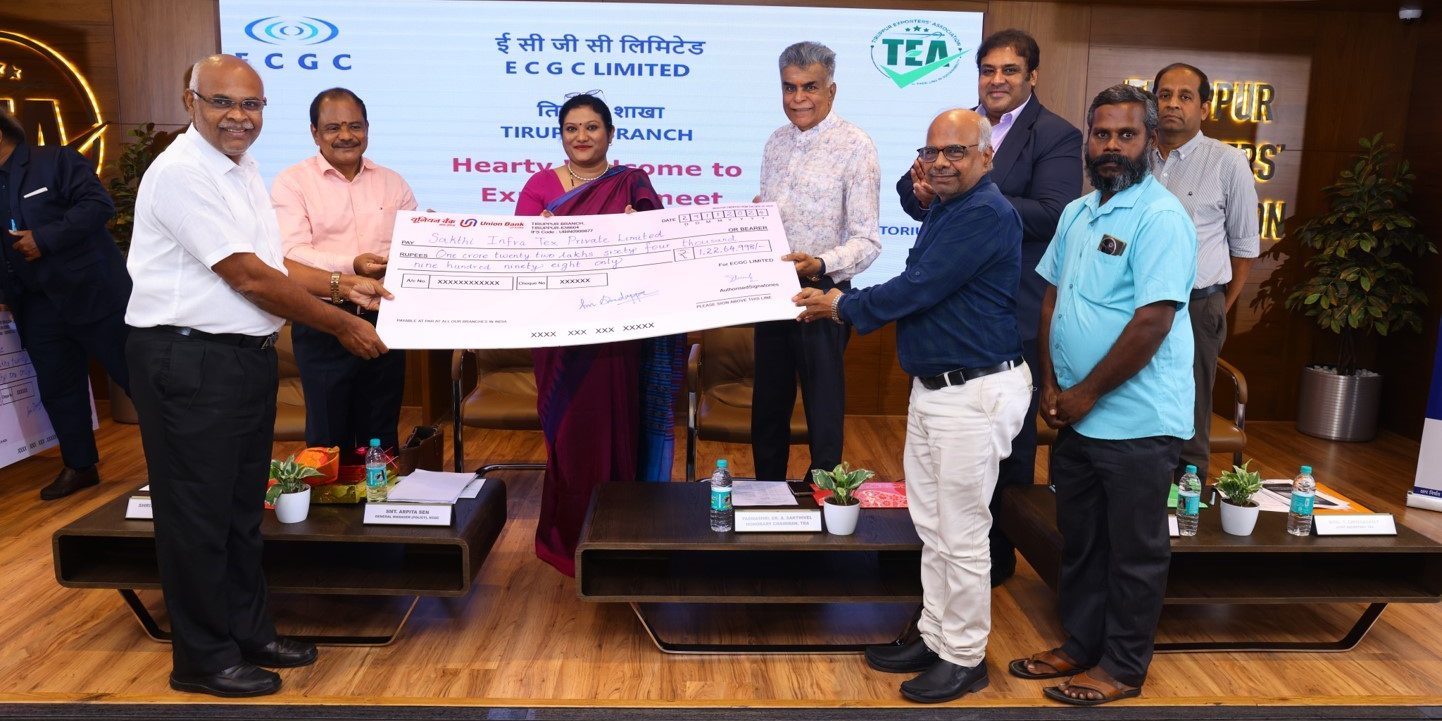 Image for Padmashree Dr. A Sakthivel and Arpita Sen handing over a cheque to a policyholder in Tirupur.