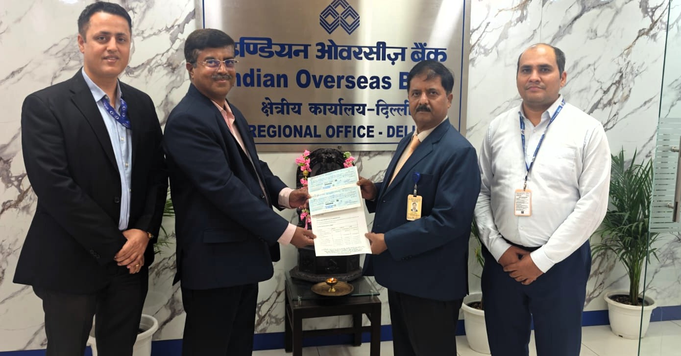 The New Delhi Branch handing over ECIB claim cheque of Rs.14.31 crore to Indian Overseas Bank a/c M/s P&G Enterprises Pvt Ltd.